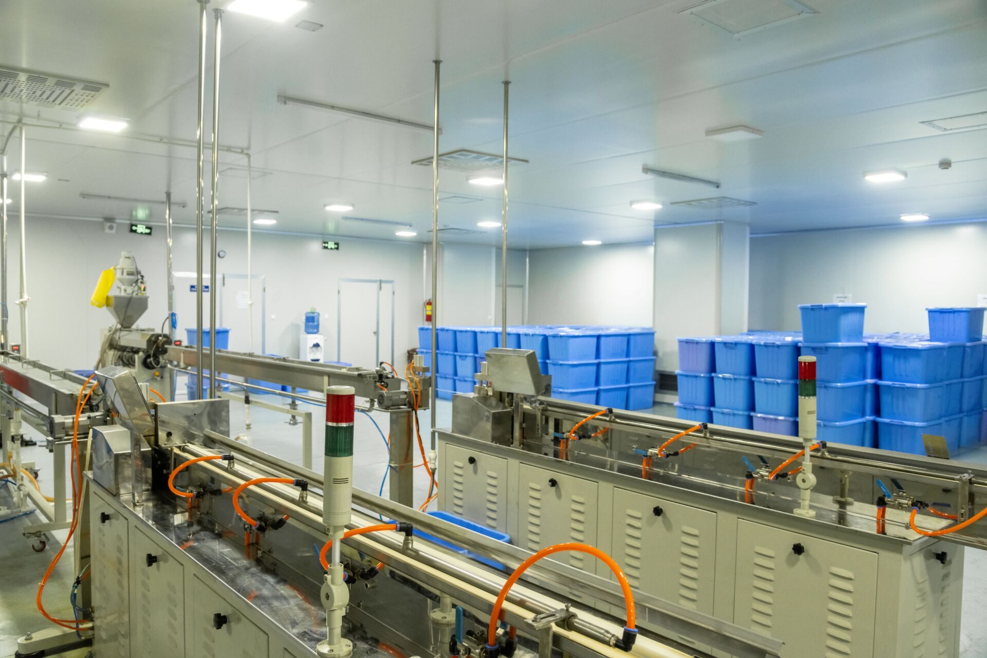Coldcase temperature controlled production area with cleanroom equipment and blue storage bins