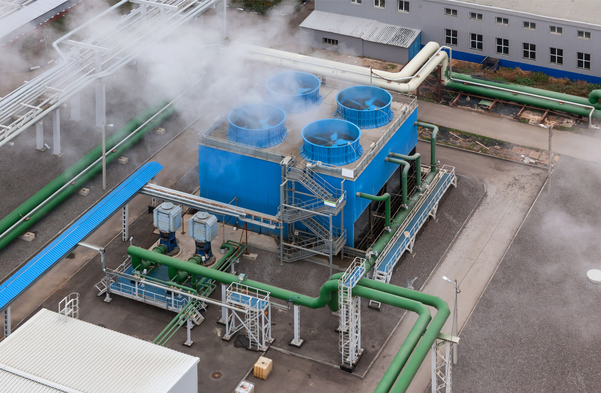 Coldcase outdoor cooling tower system with blue fans and industrial pipework