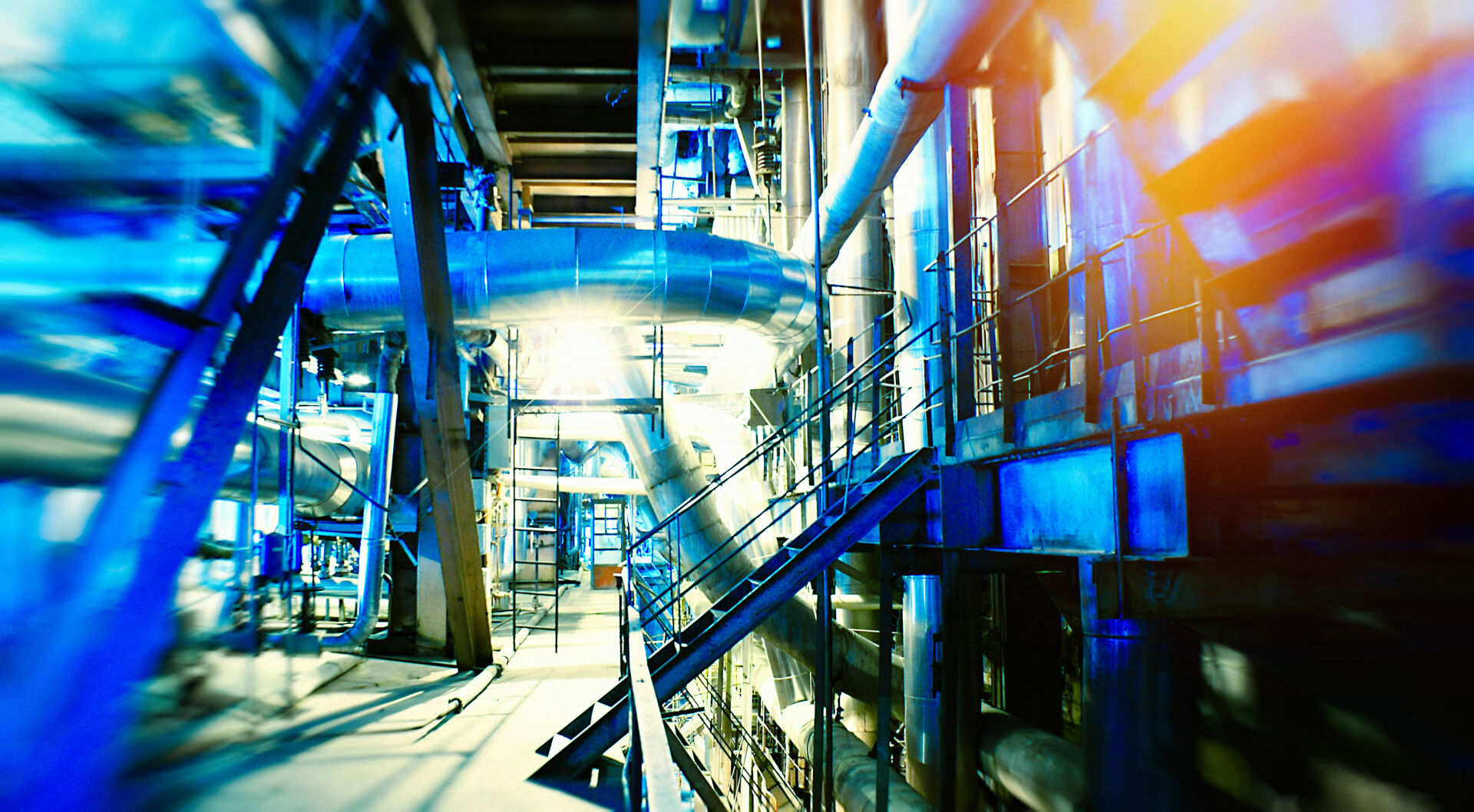 Coldcase factory refrigeration plant with metal pipework and industrial service platforms