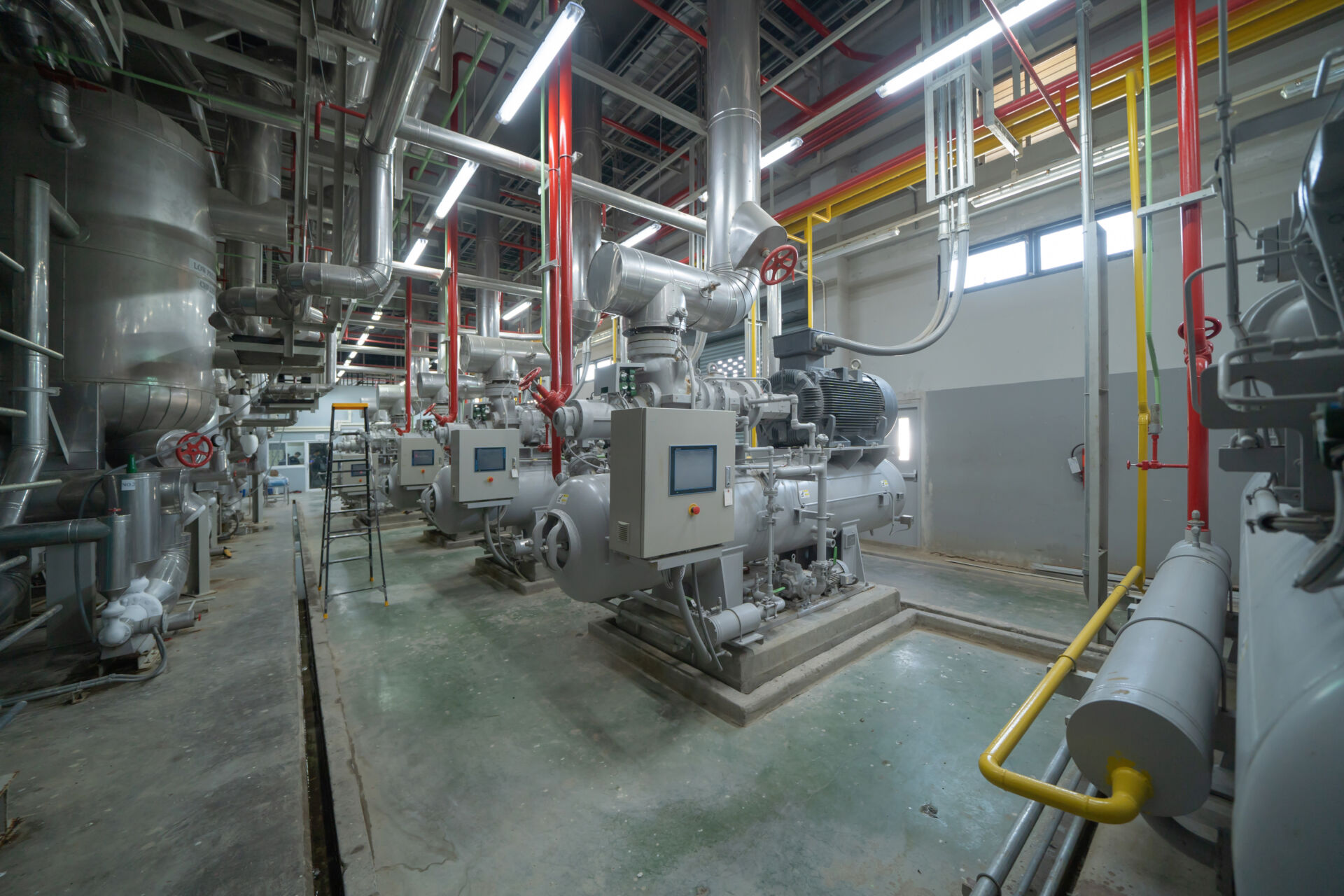 Coldcase plant room with industrial chillers, refrigeration pipework and control panels