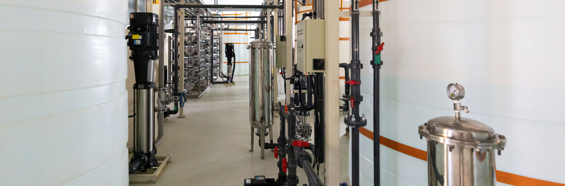 Coldcase industrial refrigeration plant room with pipework, tanks and service access